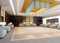 Large, carpeted hotel lobby
